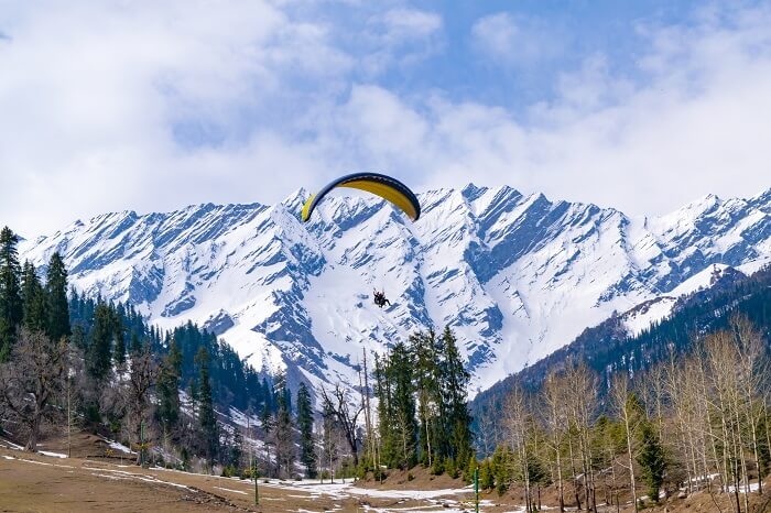 paragliding, mountain in the background