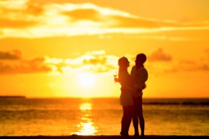 couple enjoying the sunset in a beach
