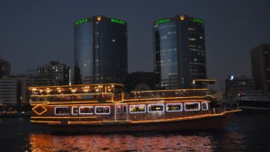 luxury ferry boat on river, two tower buildings