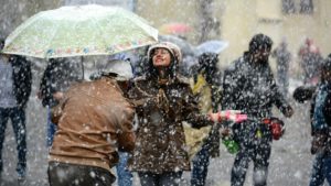people enjoying snowfall in shimla